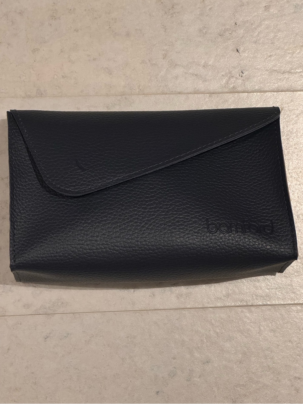 Bundle for free with any purchase. Bamford toiletries case, dark navy blue.